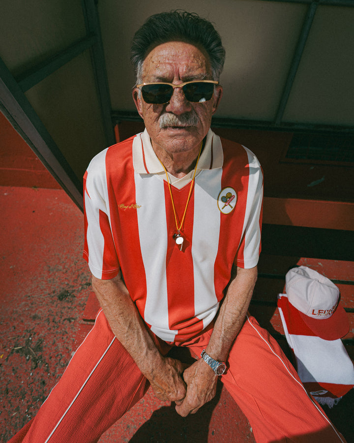 Senior male model wearing Coup D'État x Leixões classis short sleeve jersey - Red and Off-White - Coup D'État Portugal